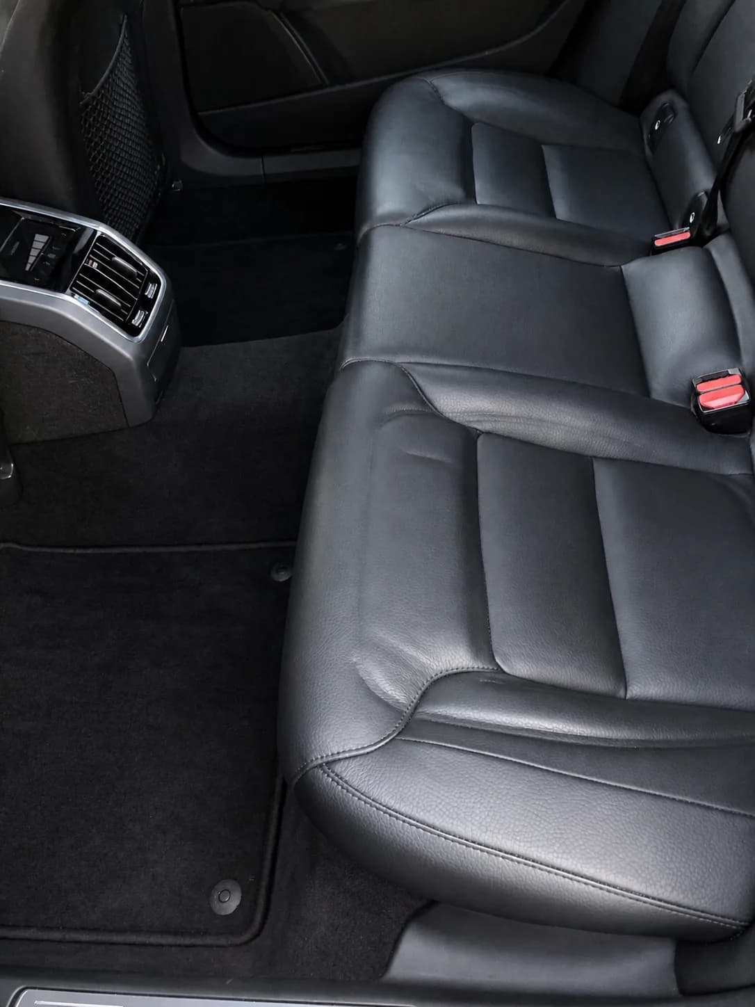 Clean black leather rear seats and carpet after interior detailing
